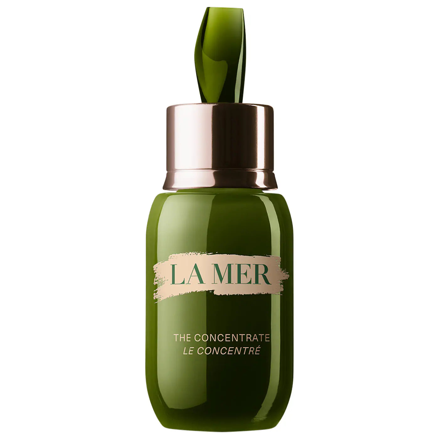 La Mer serum bottle with green glass and rose-gold cap
