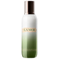 La Mer hydrating emulsion bottle with metallic cap, frosted glass, green label