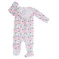 Zipper footie with long sleeves and ladybug-floral print on light background