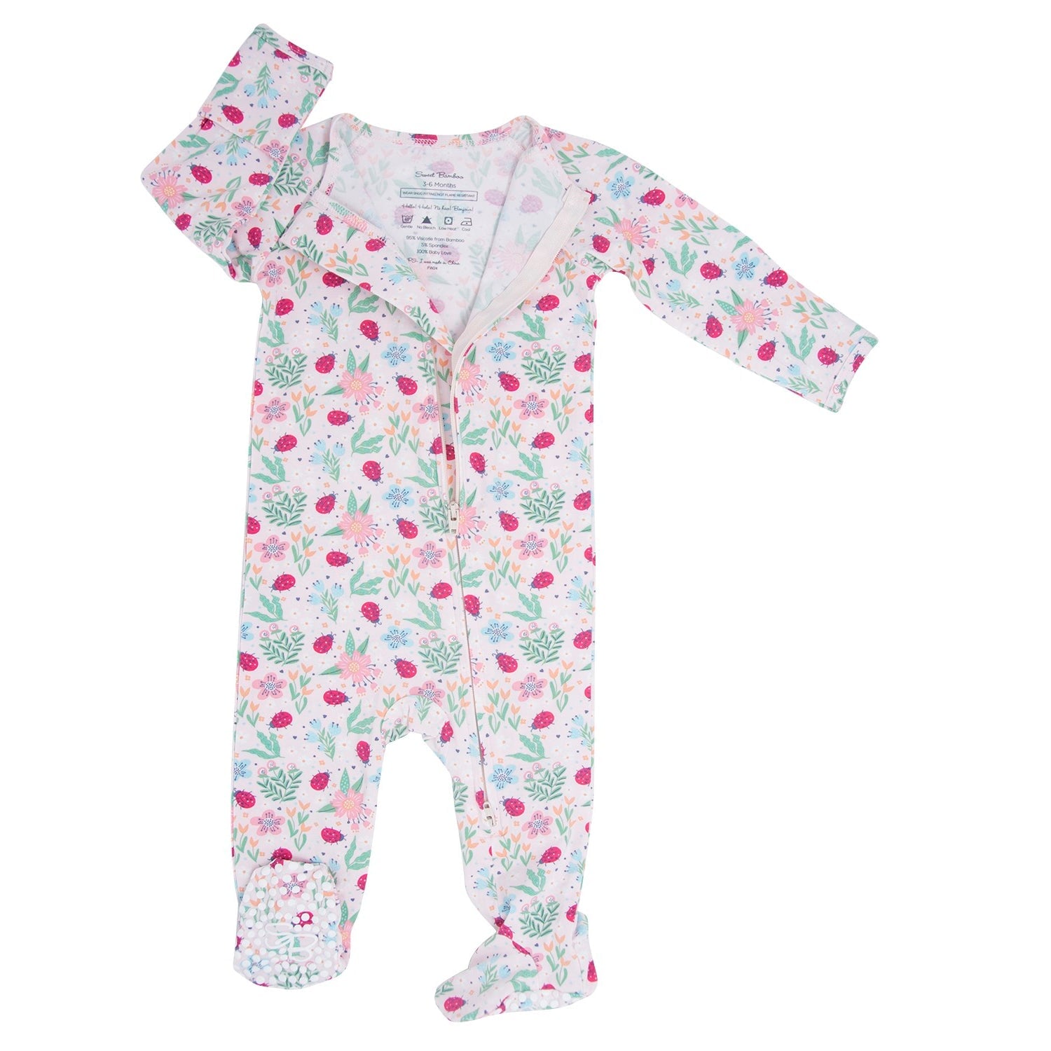 Zipper footie with long sleeves and ladybug-floral print on light background