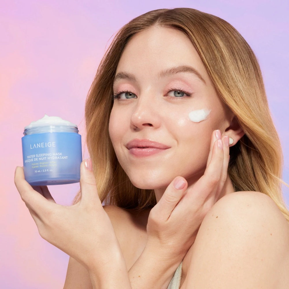 Laneige water sleeping mask jar held in hands, blue lid and gel