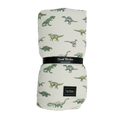 Big kid cloud blanket, off-white with green dinosaur print, folded view.