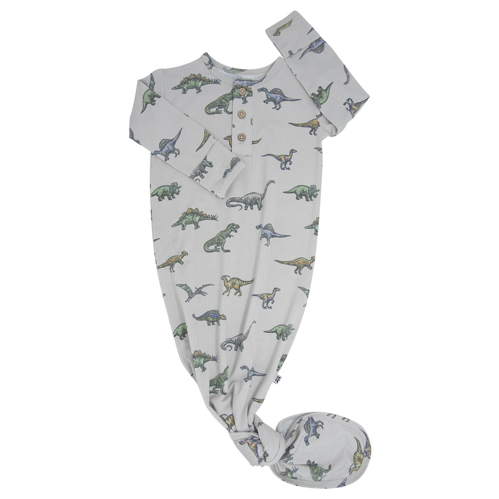 Dinosaur-print baby gown with short sleeves, button placket, and footed legs