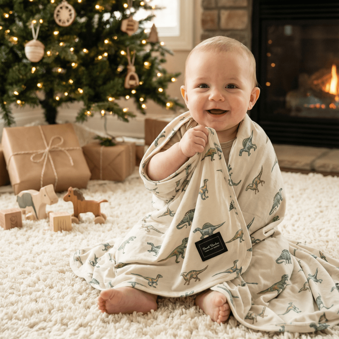 Baby swaddle blanket in cream with green dinosaur pattern, soft hooded wrap
