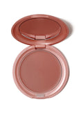 Stila Convertible Color compact with rosy-brown powder pan, lid open
