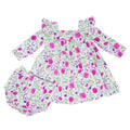 Girls ruffle dress in white with pink-purple floral print and bloomers