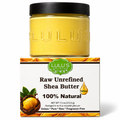 Raw shea butter jar, yellow butter in glass with green Lulu's label.