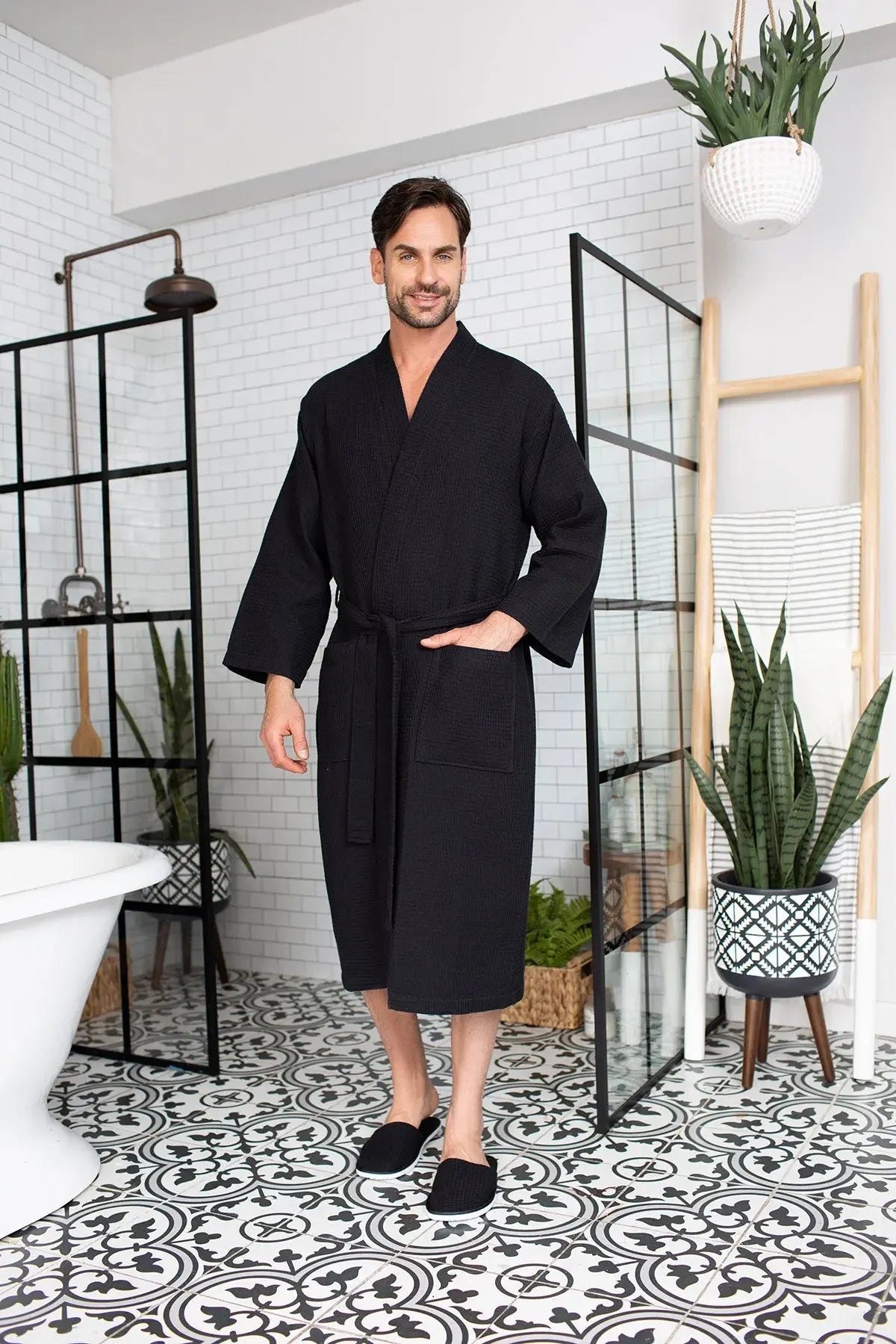 Men's waffle bathrobe, black, belted wrap front, V-neck, full-body view.