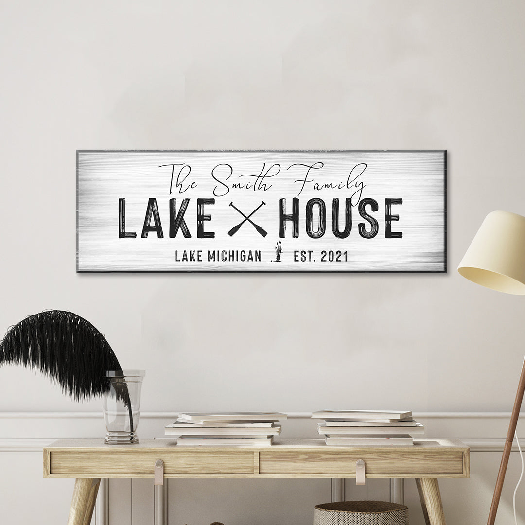 Lake house sign with Smith Family, black lettering, and Est. 2021 on white woodgrain panel