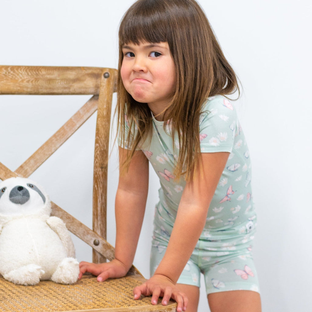 Girls mint bamboo pajama set with butterfly and daisy print, short-sleeve top and shorts