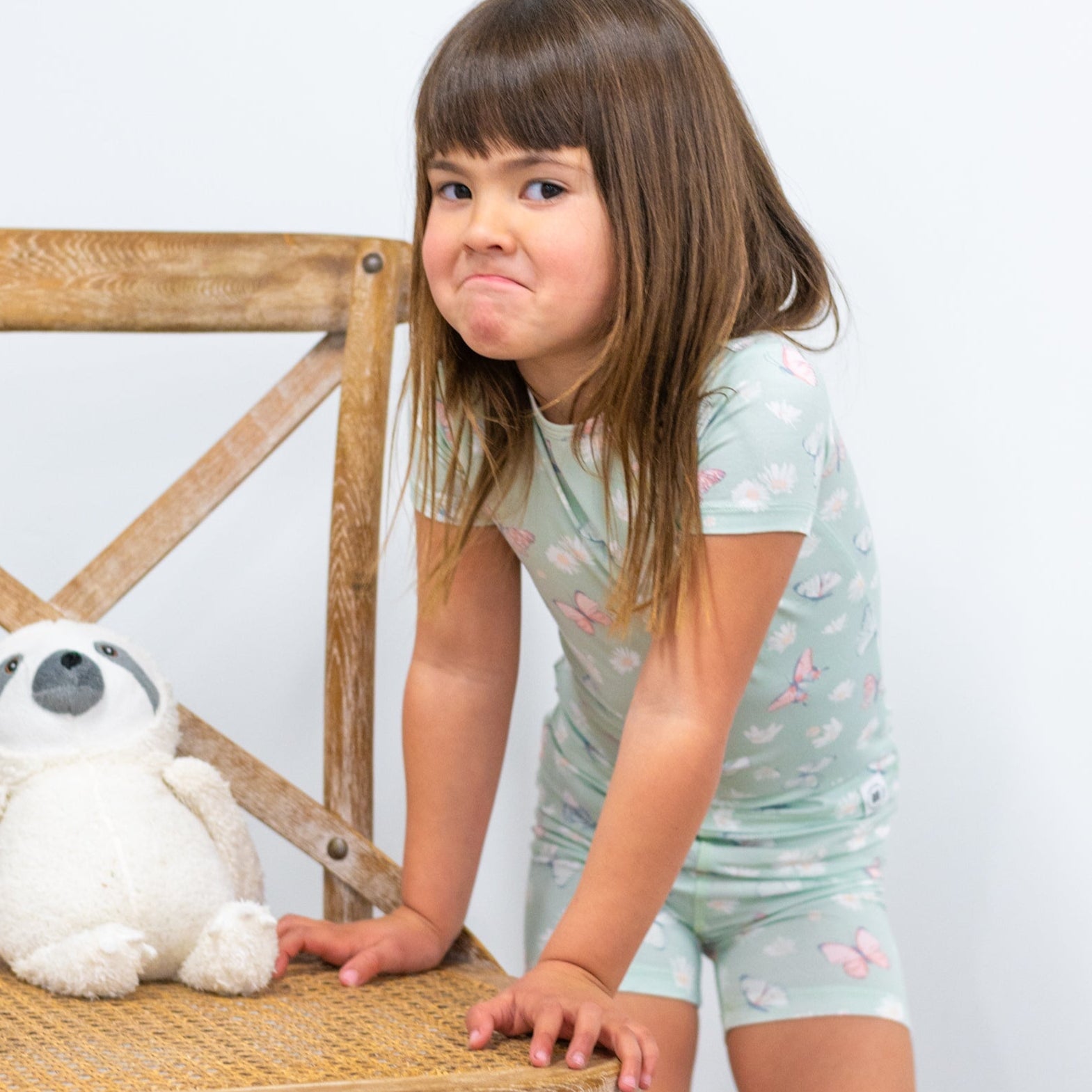 Girls mint bamboo pajama set with butterfly and daisy print, short-sleeve top and shorts