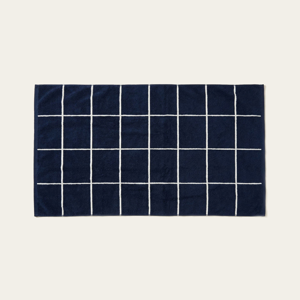 Navy cotton towel with white grid stripe pattern
