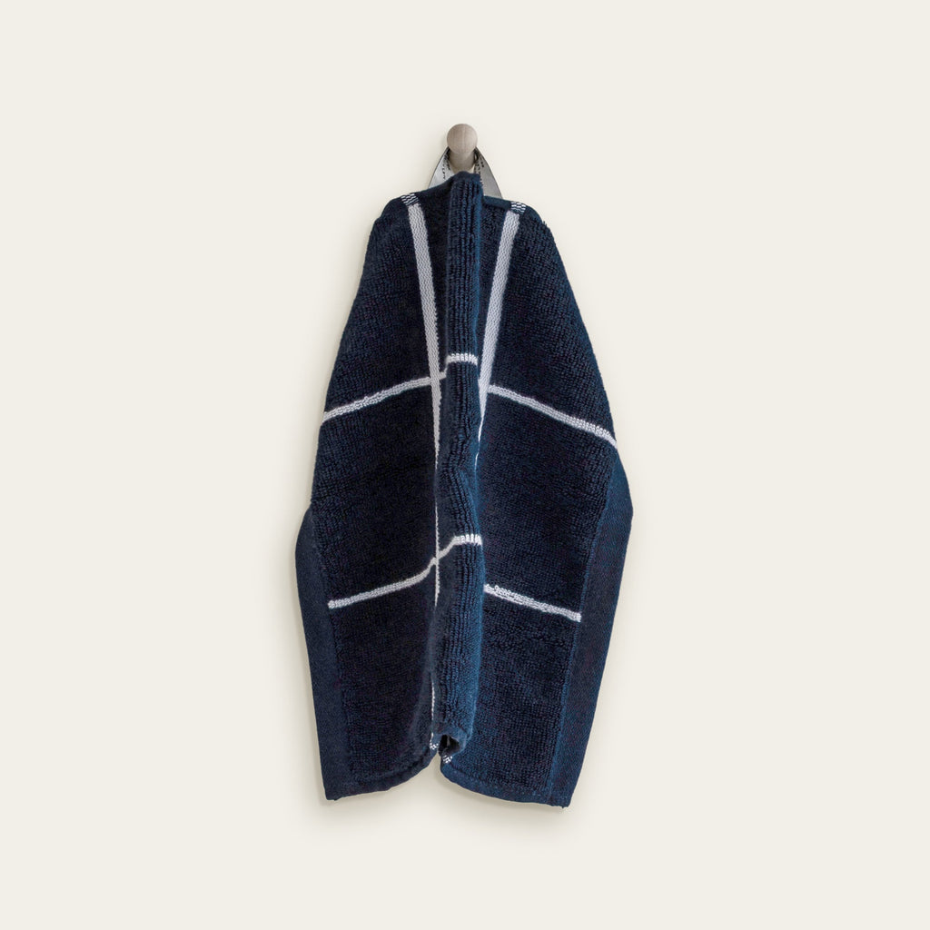 Hanging navy cotton towel with thick white grid stripes