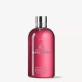Molton Brown Fiery Pink Pepper bath & shower gel bottle, pink with silver cap
