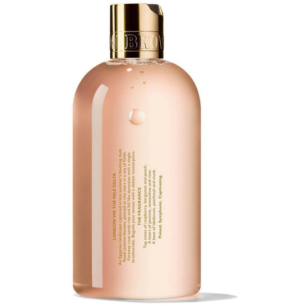 Bath & shower gel bottle, back label view, peach-pink with gold cap.