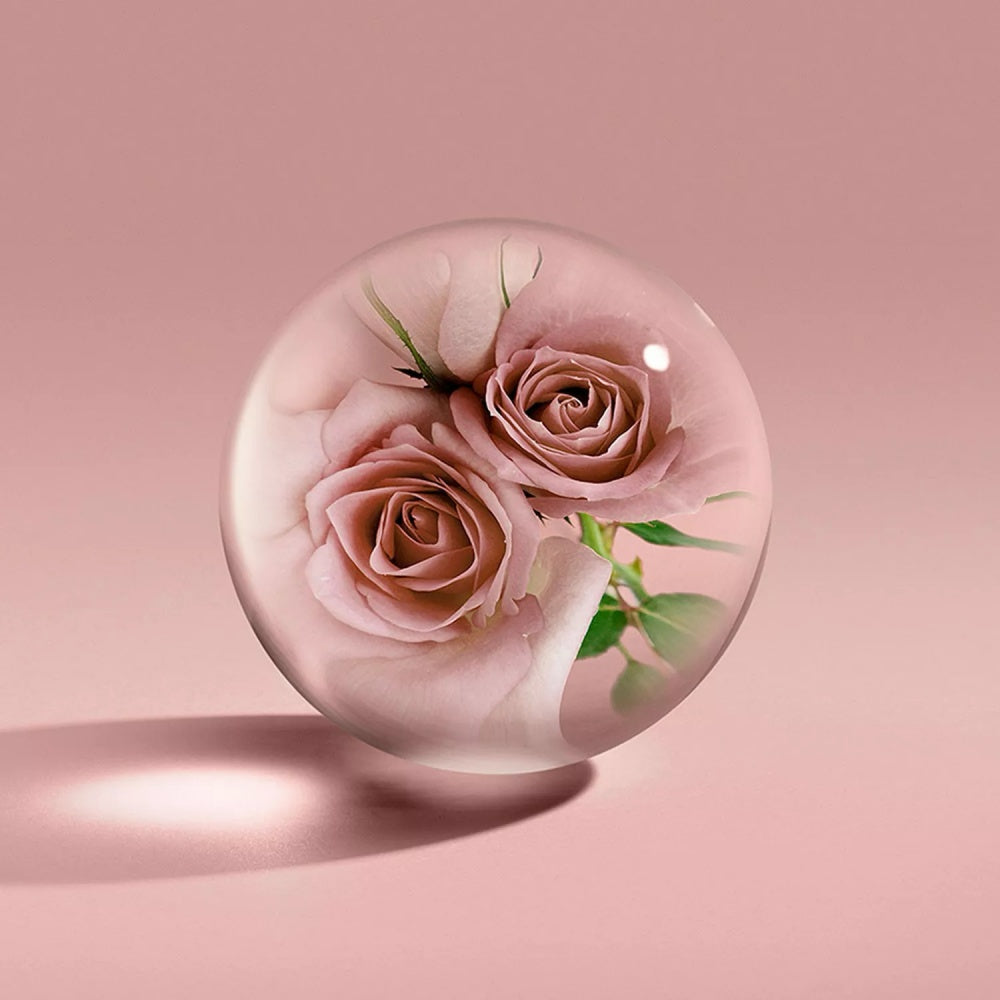 Rose Dunes bath gel with floating roses in a clear spherical gel drop