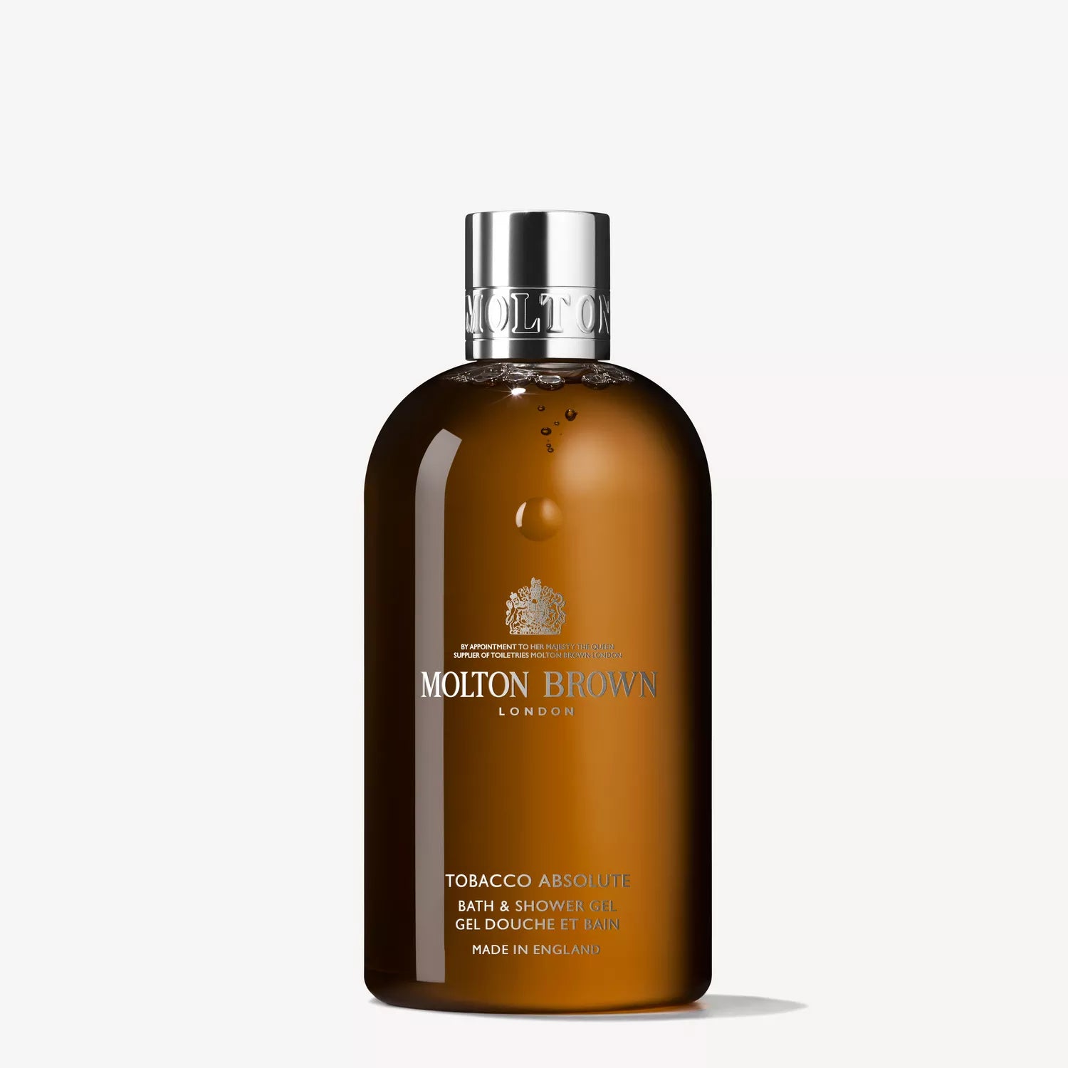 Molton Brown bath and shower gel bottle, dark amber with silver cap