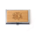 Monogram wood business card holder with engraved initials on tan wood front