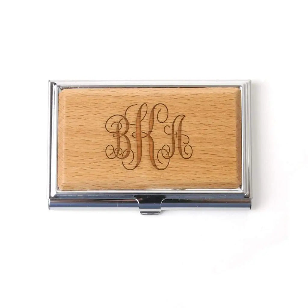 Monogram wood business card holder with engraved initials on tan wood front