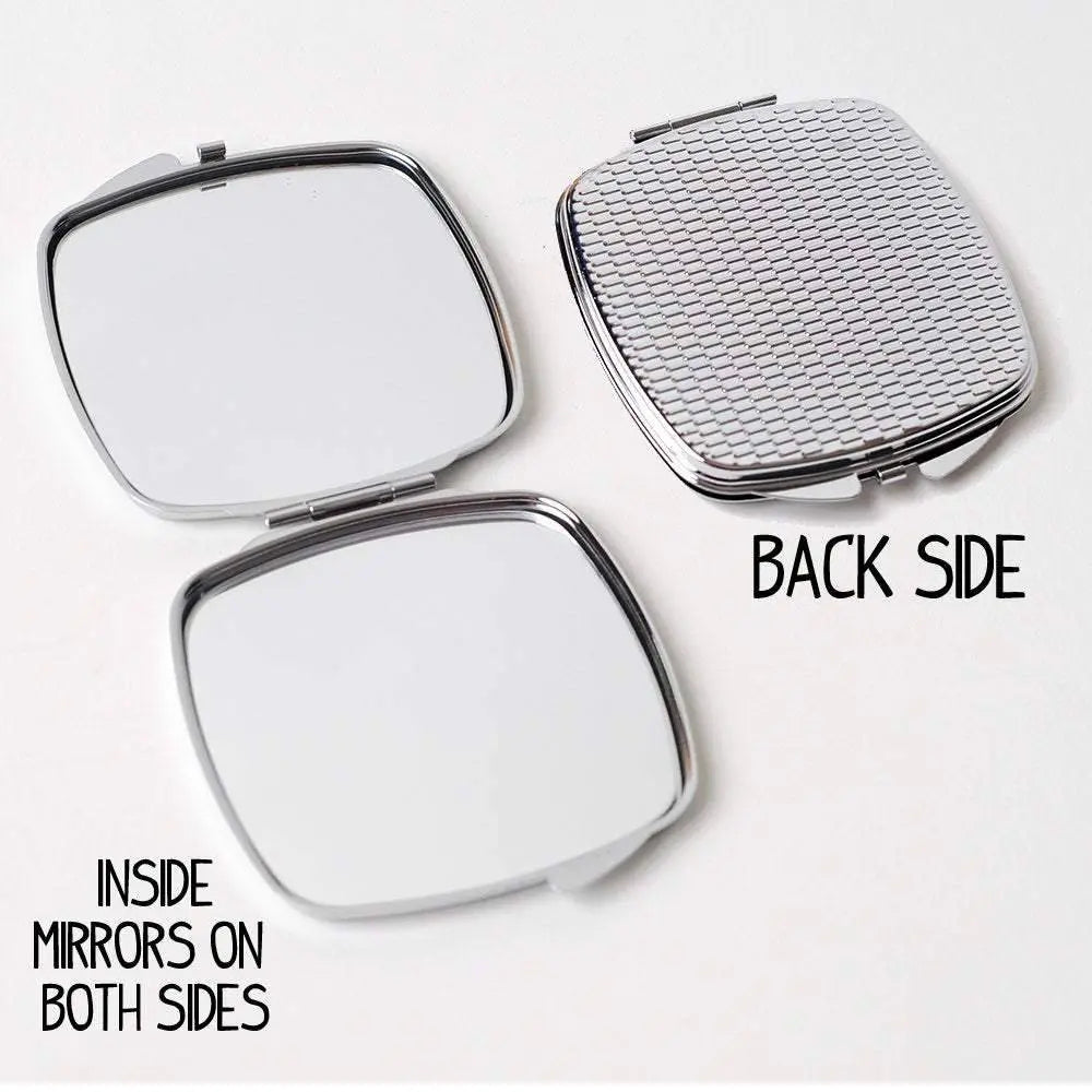 Square compact mirror open to inside mirrors, with textured back side.