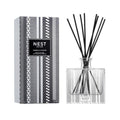 Reed diffuser set with amber & incense bottle, black reeds, and patterned gift box