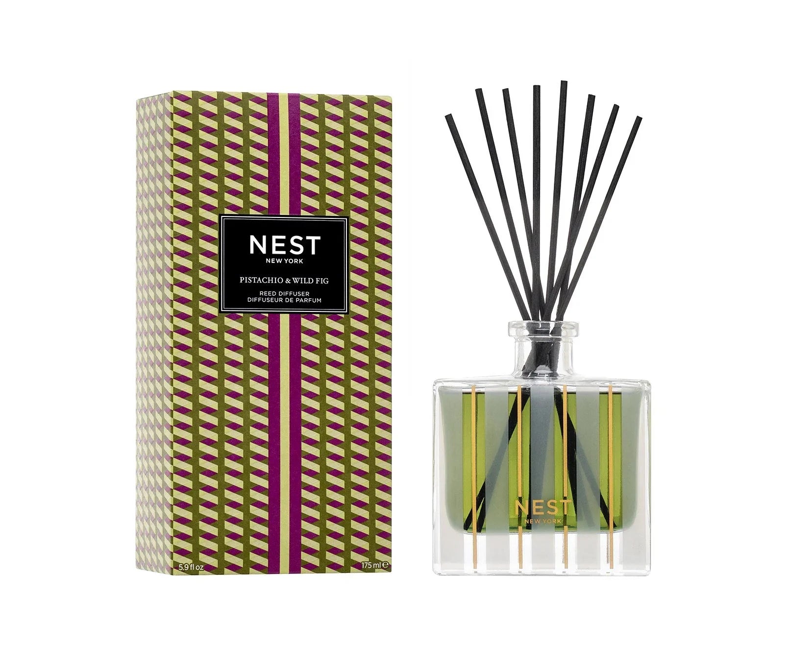 Glass reed diffuser with black reeds, green label, and geometric green-and-brown gift box