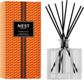 Pumpkin Chai reed diffuser set with clear glass bottle and black reed stems