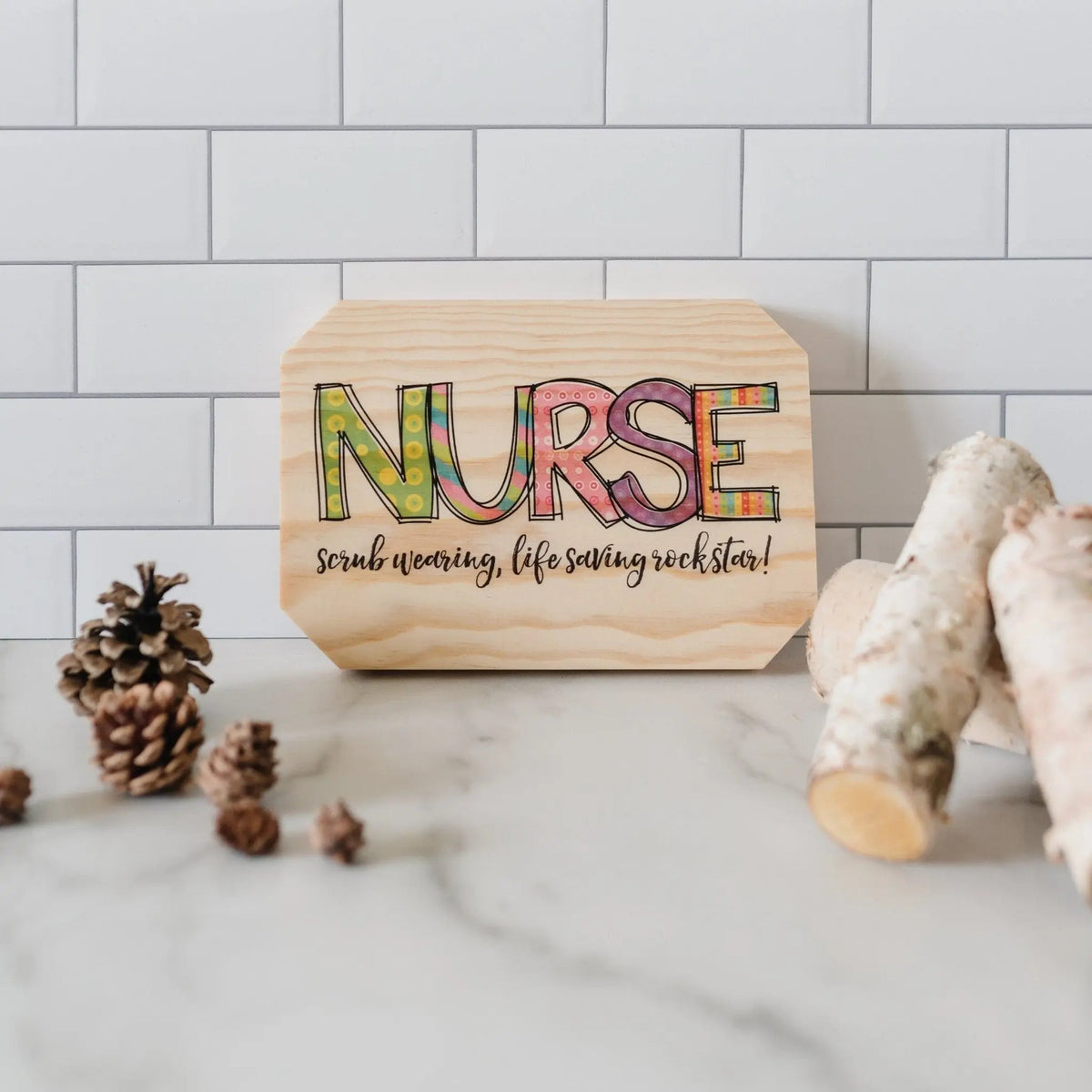 Nurse wooden wall sign with colorful 'NURSE' text and 'rockstar' message