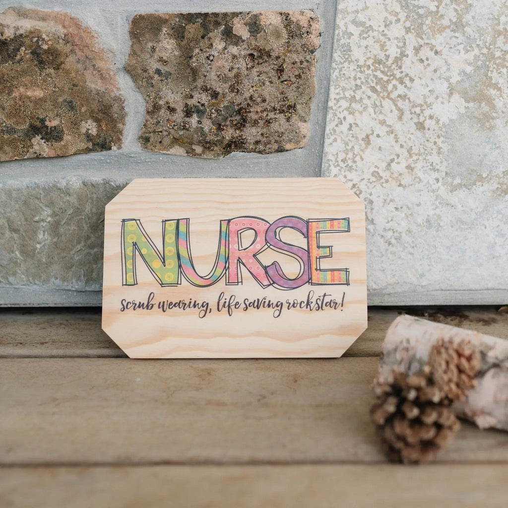 Nurse wooden wall sign on a surface with colorful 'NURSE' lettering and 'rockstar' quote