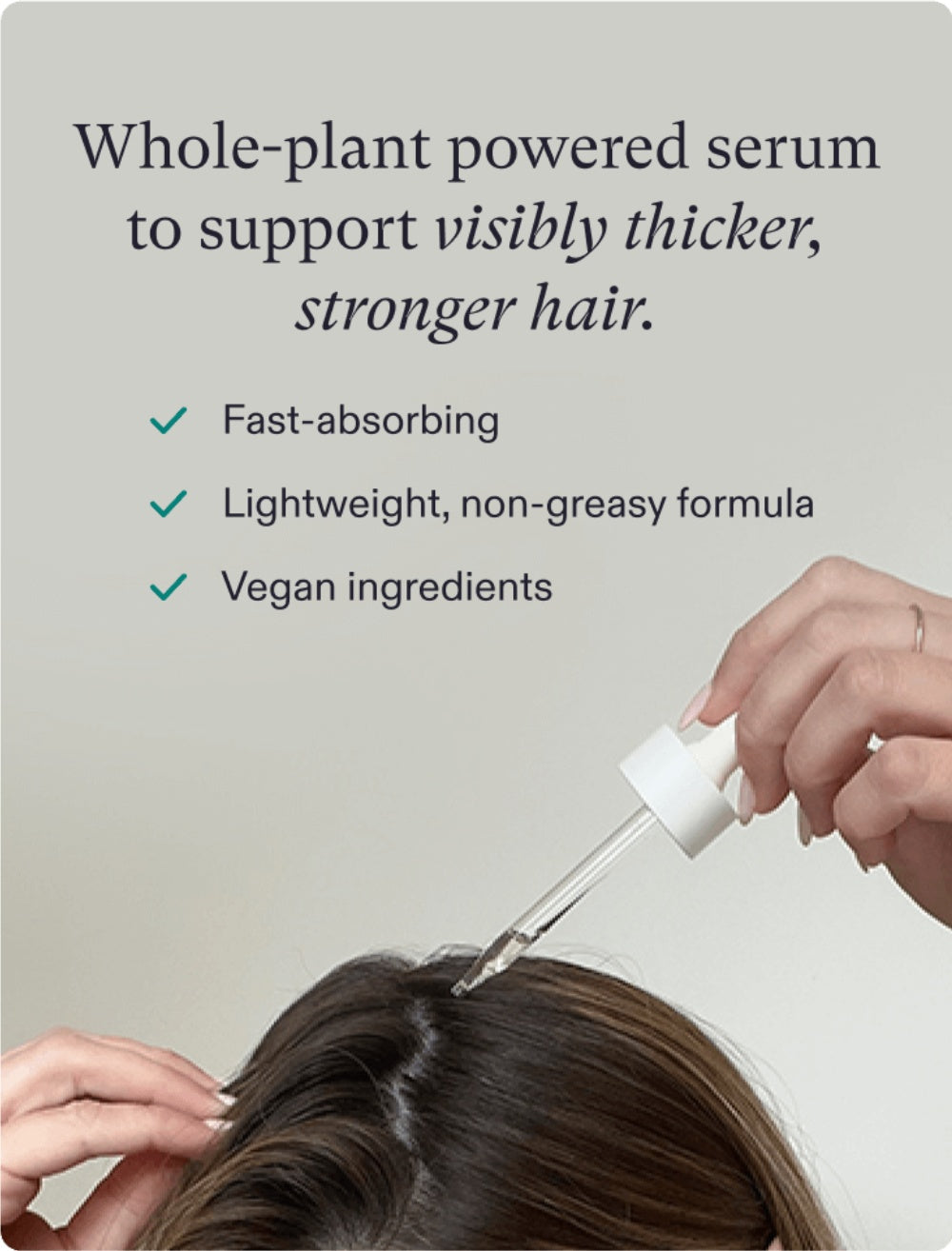 Nutrafol hair serum dropper applying serum to scalp hair