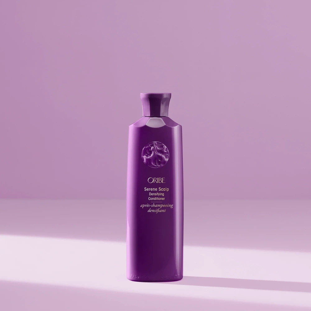 Purple Oribe conditioner bottle, front view with swirling logo and label