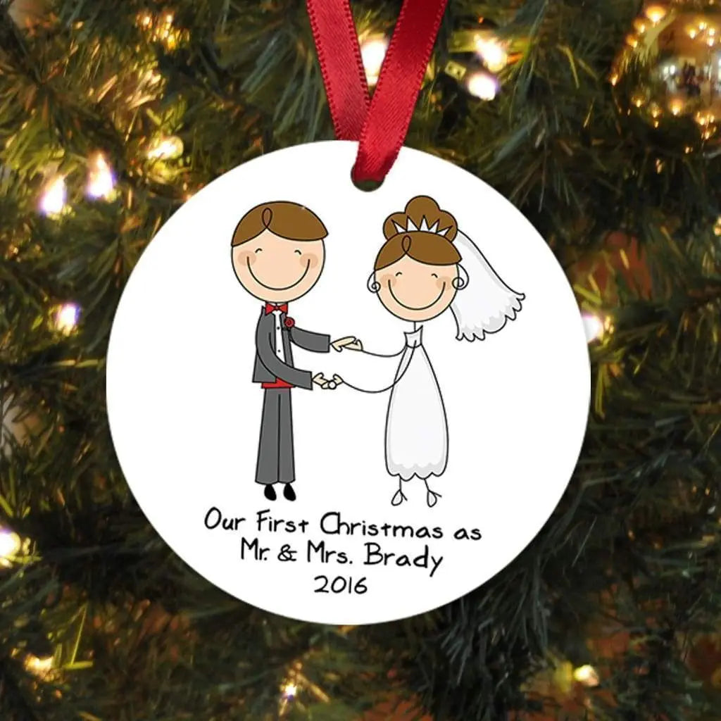 Round white personalized Christmas ornament with couple illustration and red hanging ribbon