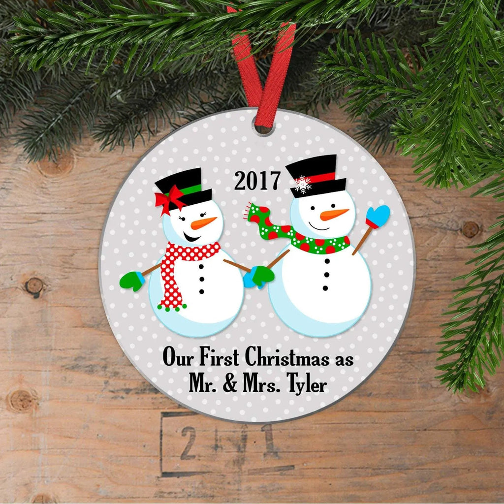 Round white Christmas ornament with two smiling snowmen, 2017, and personalized text