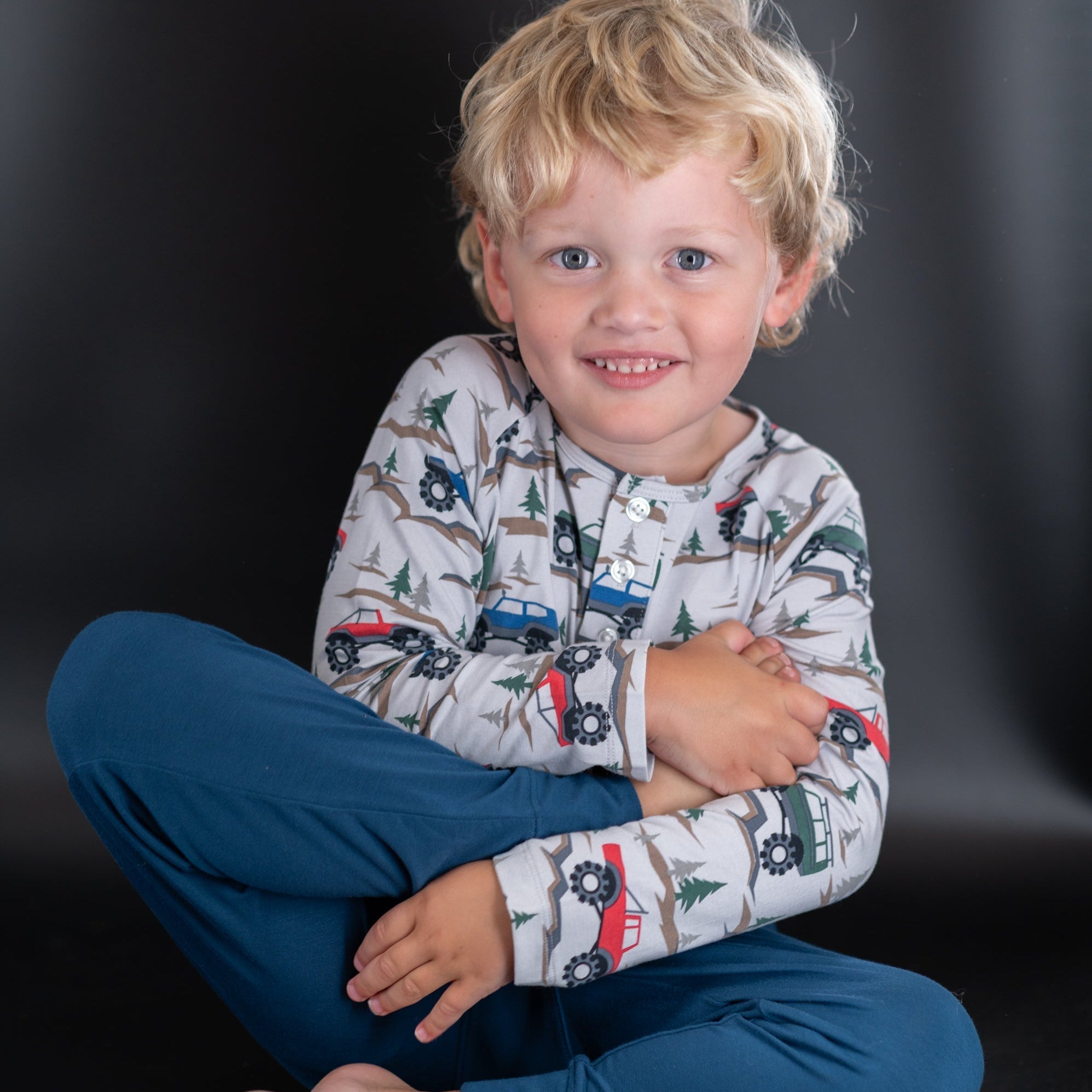 Boys raglan henley top in cream with red, blue and green vehicle print and henley buttons