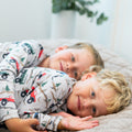 Boys raglan henley pajama shirt in cream with vehicle and tree print, long sleeves