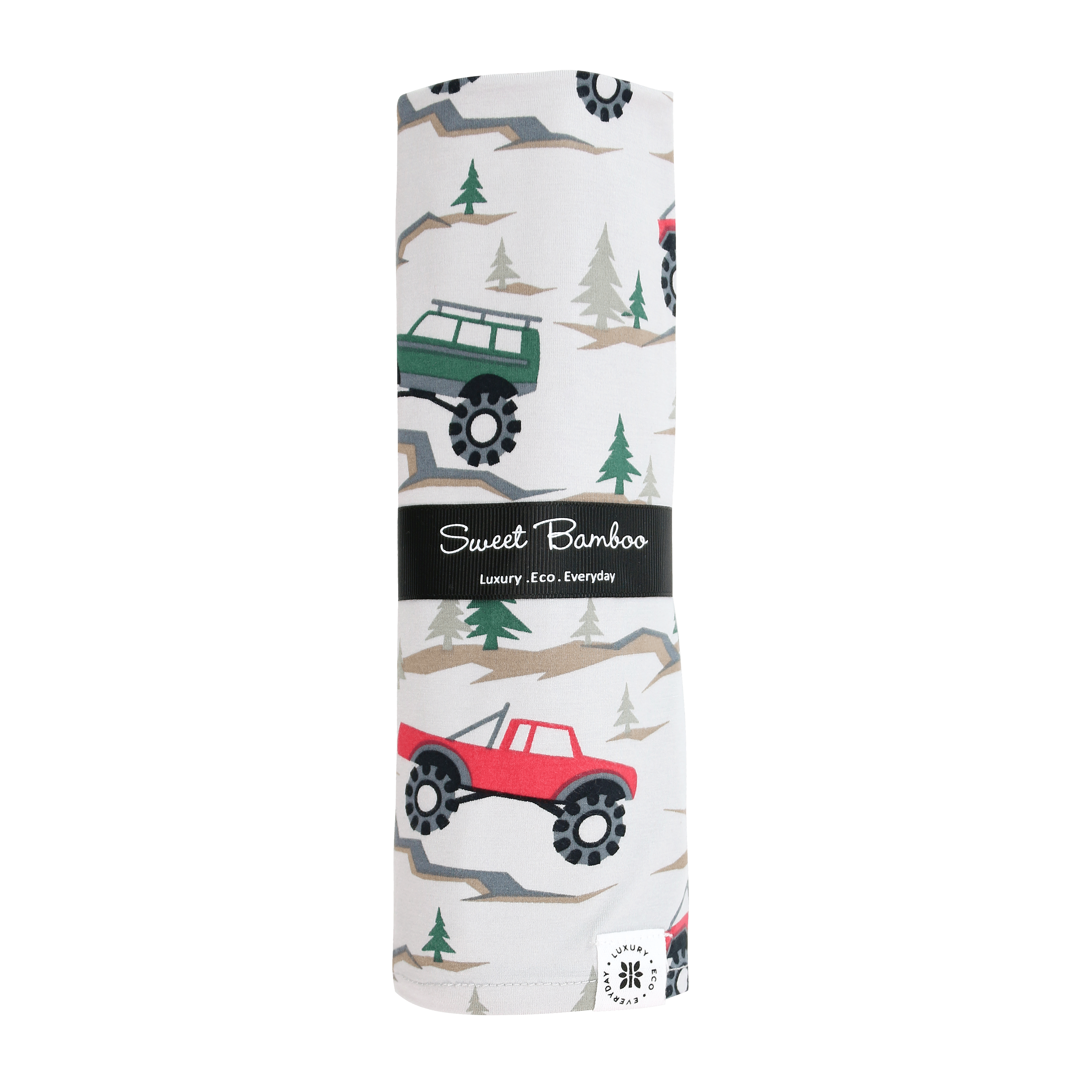 Baby swaddle blanket with forest and truck pattern, white base, green and red vehicles.