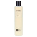 PCA Skin facial wash bottle, black cap, pale cream liquid, 7 fl oz