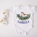 White short-sleeve baby bodysuit with woodland bird and floral wreath, 'ISABELLA' print