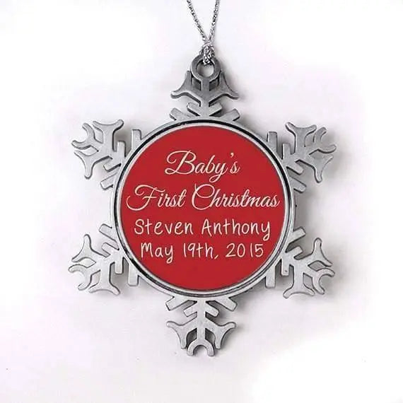 Baby's first Christmas ornament, silver snowflake frame, red center with 'Baby's First Christmas'