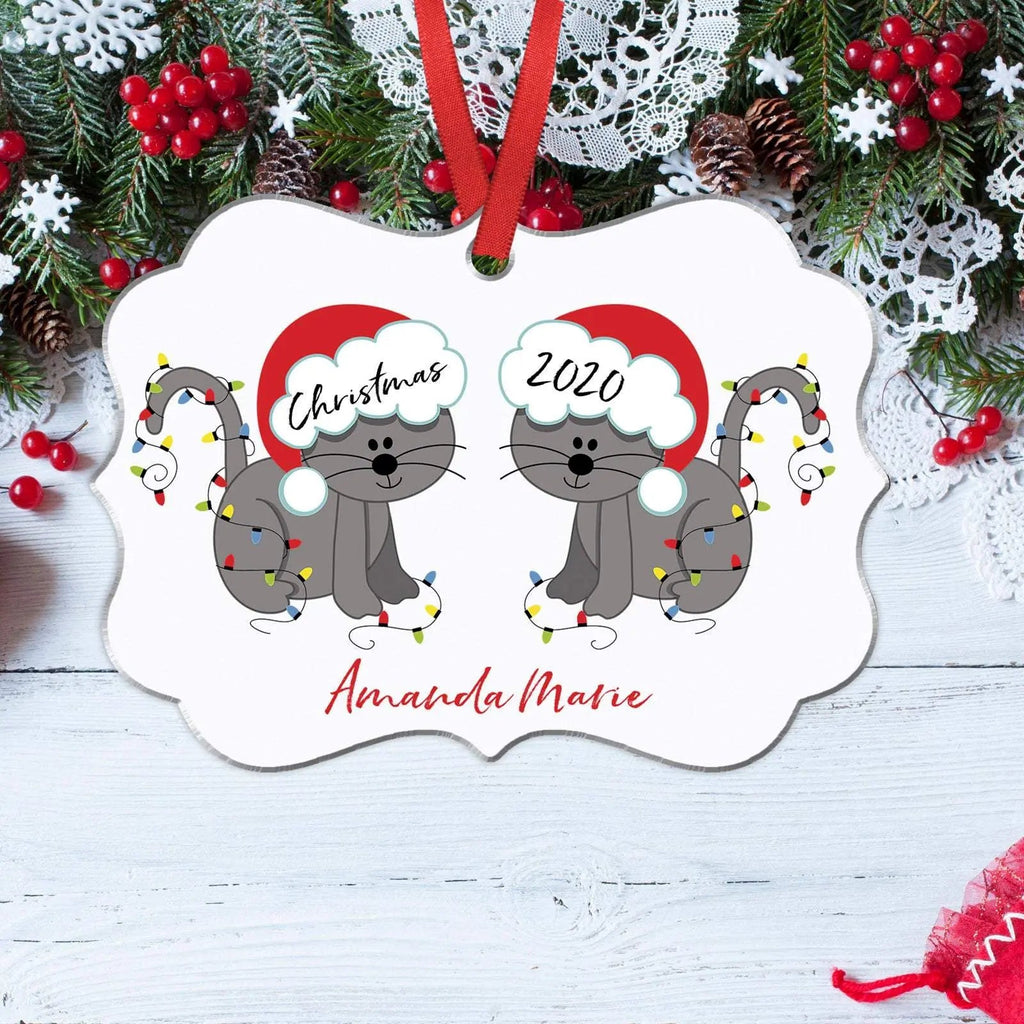 White hanging cat ornament with two gray cats, red bell accents, personalized name
