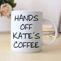White coffee mug with black 'HANDS OFF KATE'S COFFEE' lettering