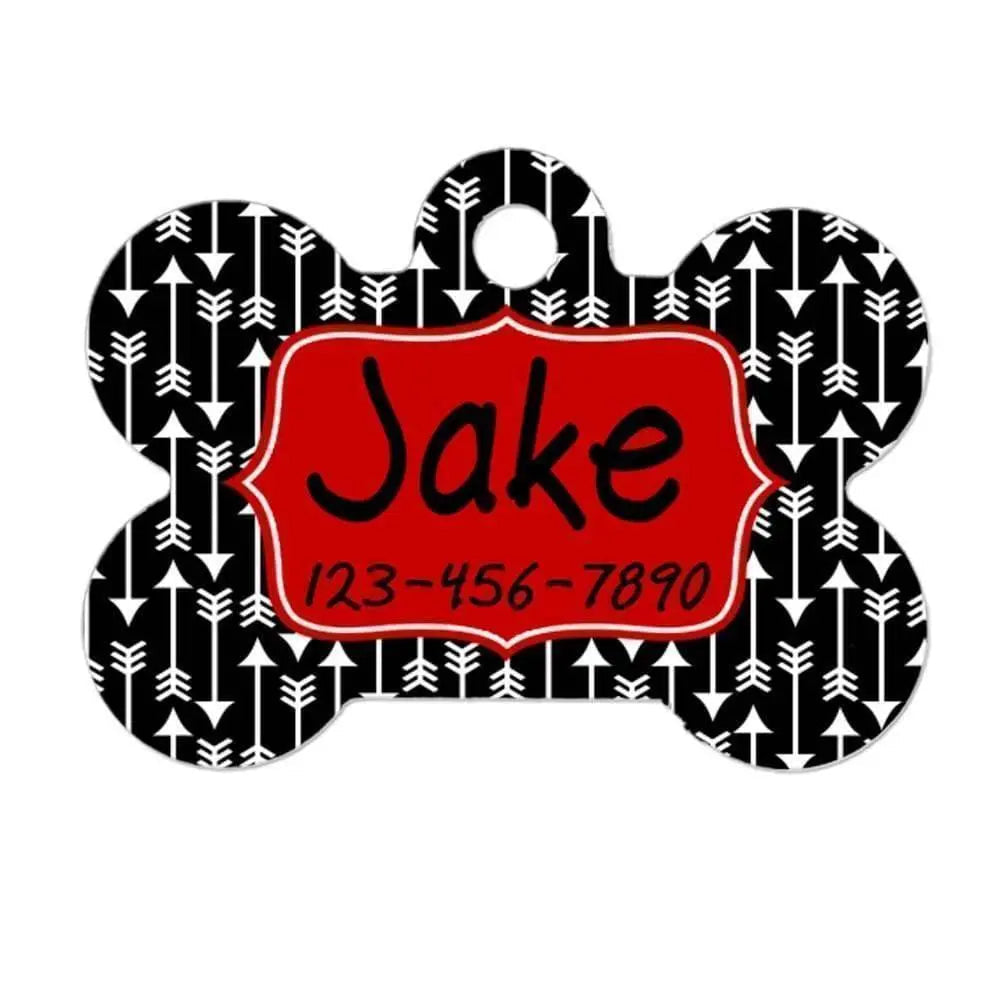 Personalized dog ID tag in arrow-bone shape, red center with name and number on black pattern
