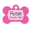 Pink polka-dot bone-shaped dog ID tag with Rosie and 123-456-7890 printed on it.