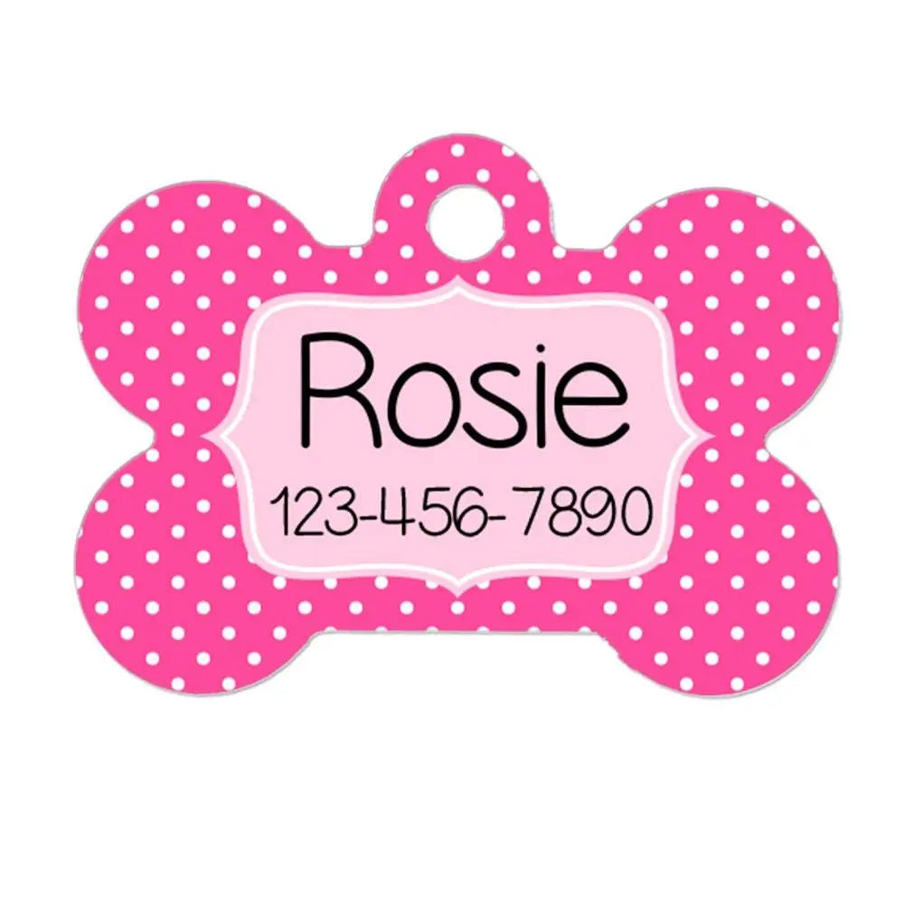 Pink polka-dot bone-shaped dog ID tag with Rosie and 123-456-7890 printed on it.