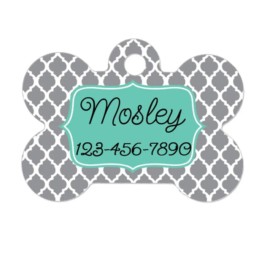 Gray bone-shaped pet ID tag with teal nameplate reading Mosley and 123-456-7890