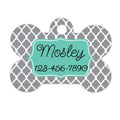 Gray bone-shaped pet ID tag with teal nameplate reading Mosley and 123-456-7890