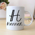 White ceramic mug with black 'hannah' name and monogram print