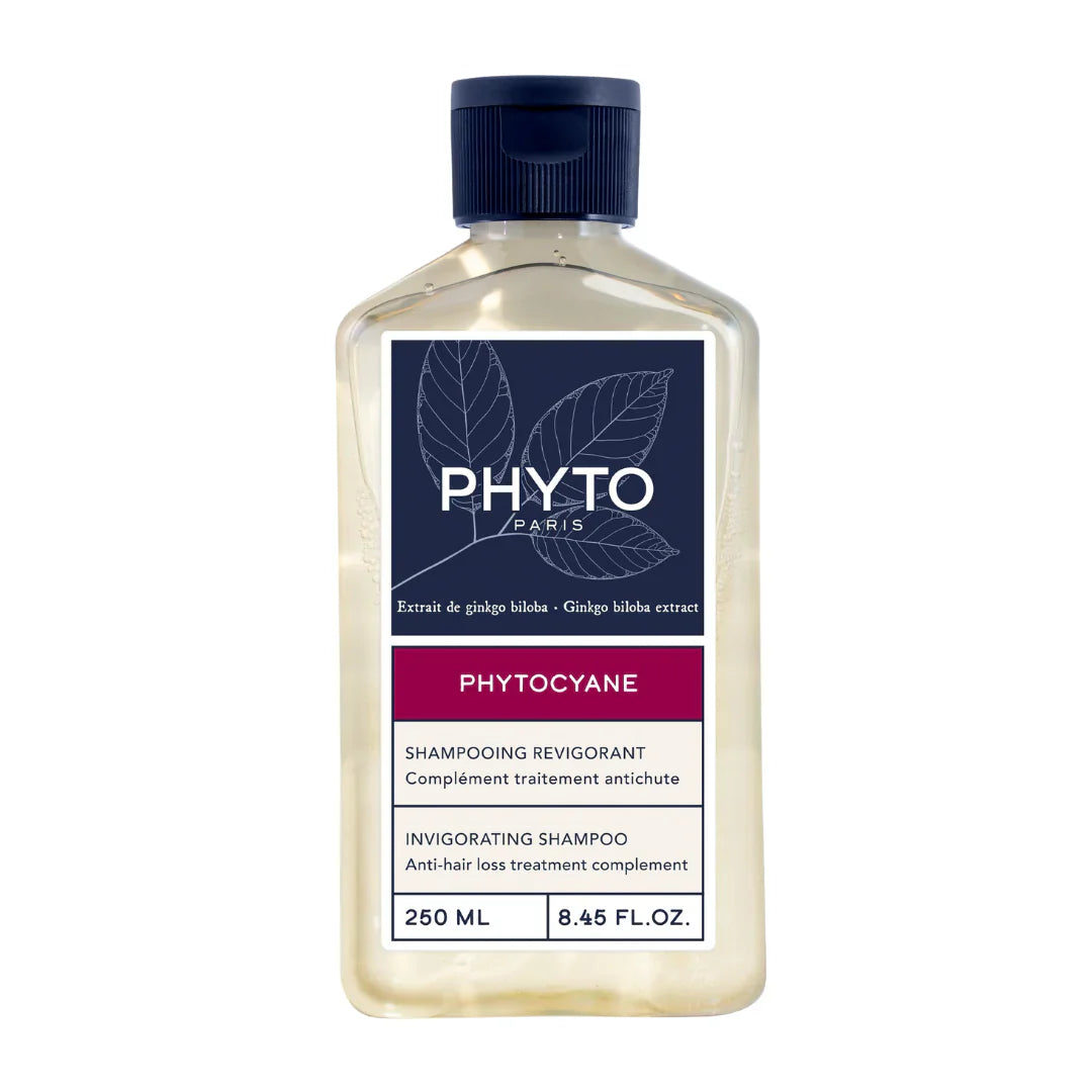 Shampoo bottle with clear liquid, dark blue cap, and PHYTOCYANE label