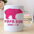 White coffee mug with pink bear silhouette and “MAMA BEAR” text