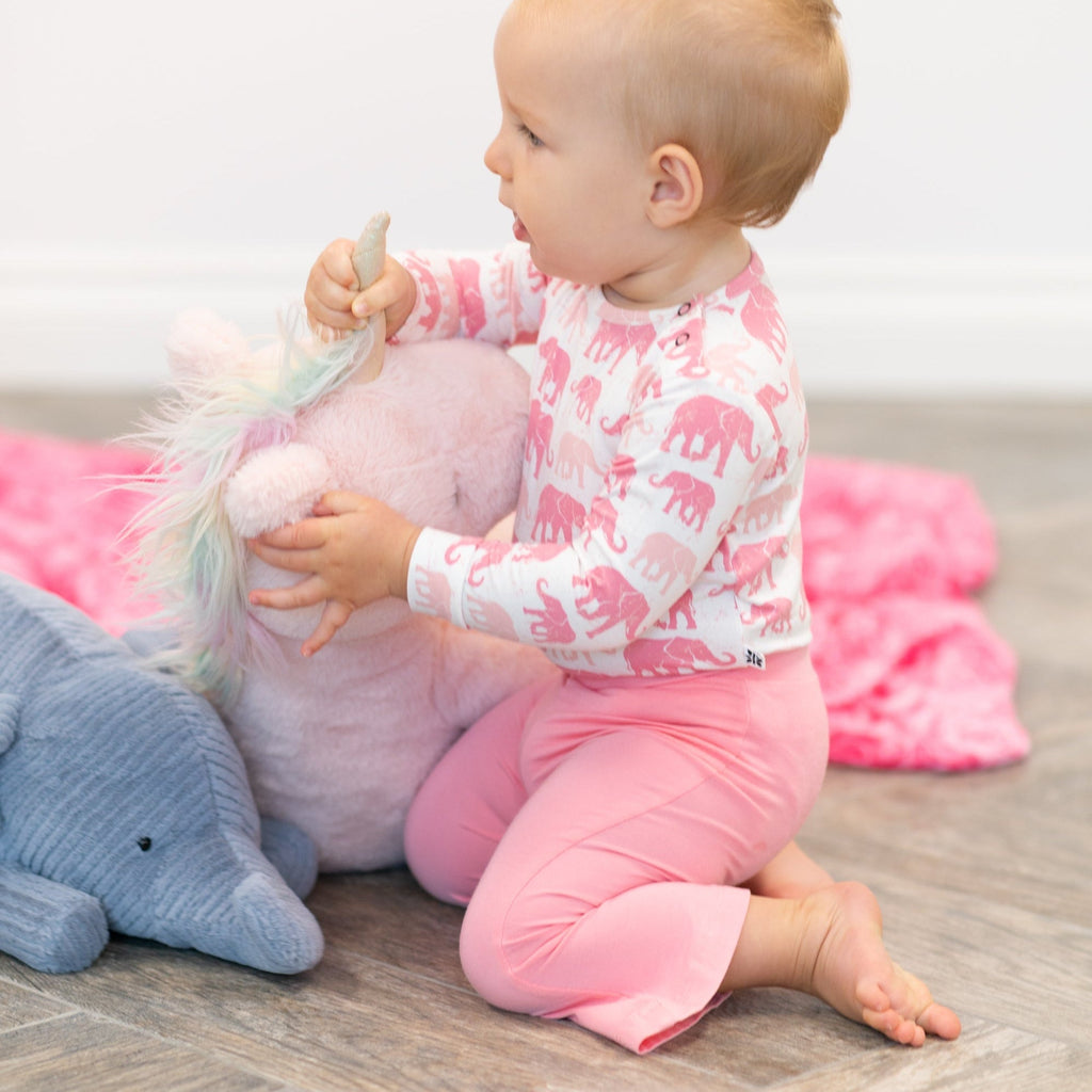 Girl’s candy pink flare leggings with elastic waistband and long bell-bottom legs